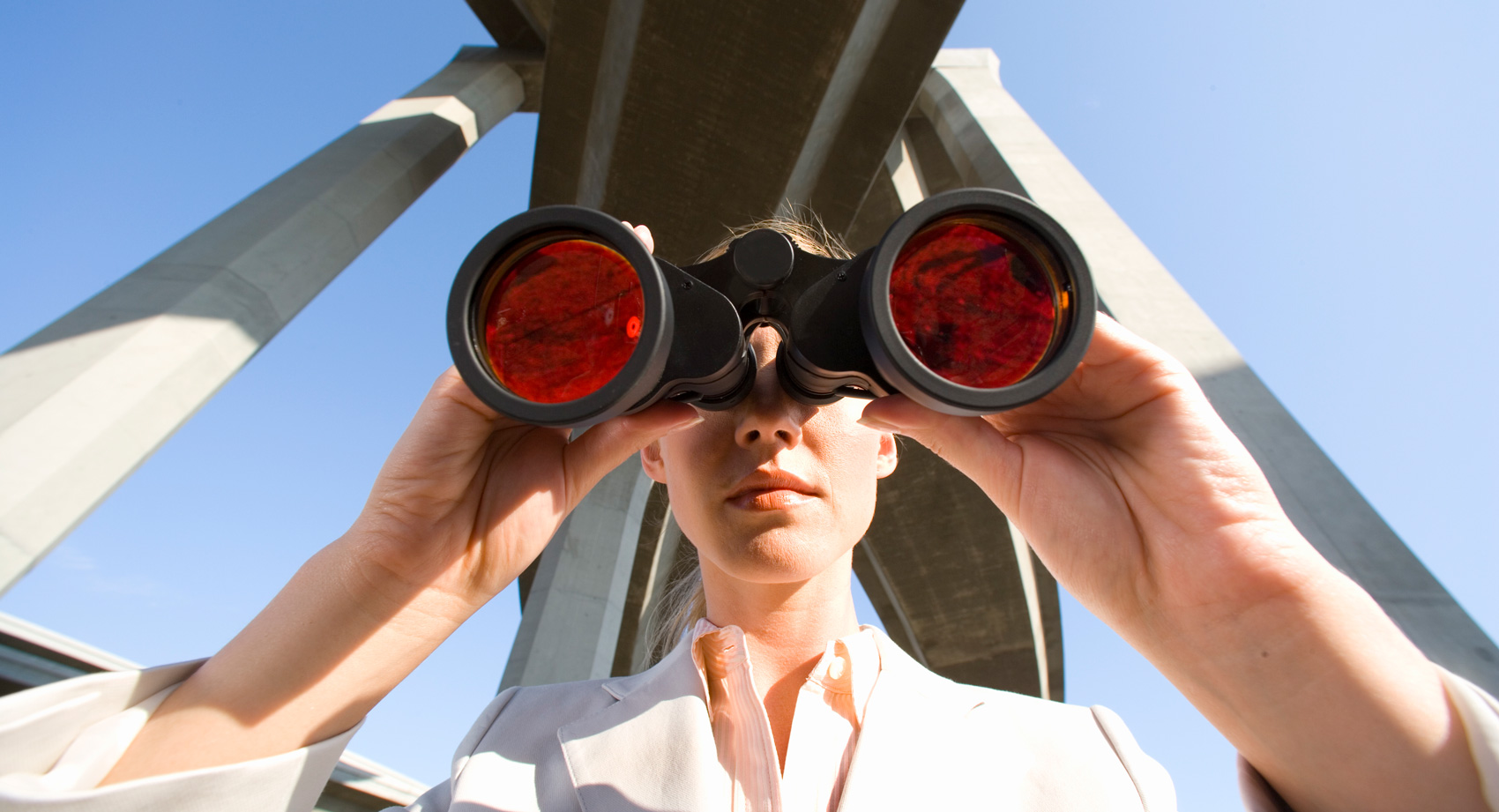 photo of a woman looking through binoculars